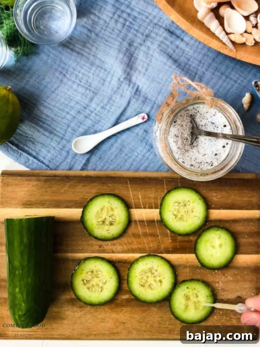 Freshly squeezed lime juice is drizzled over mint-sugar coated cucumber slices, creating a vibrant marinade for the Moscow Mule.