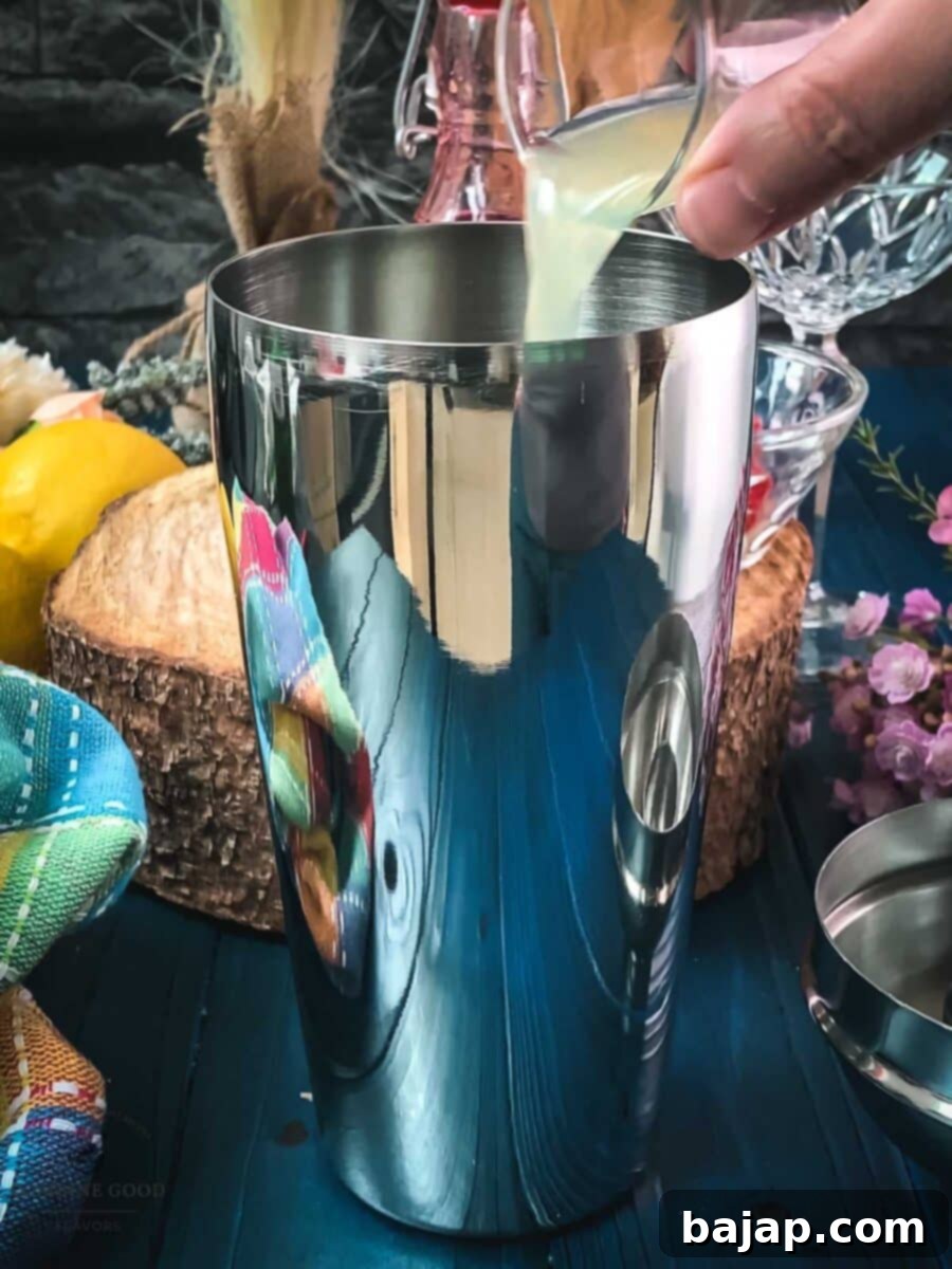 Add fresh lemon juice to the shaker to provide the essential tartness.