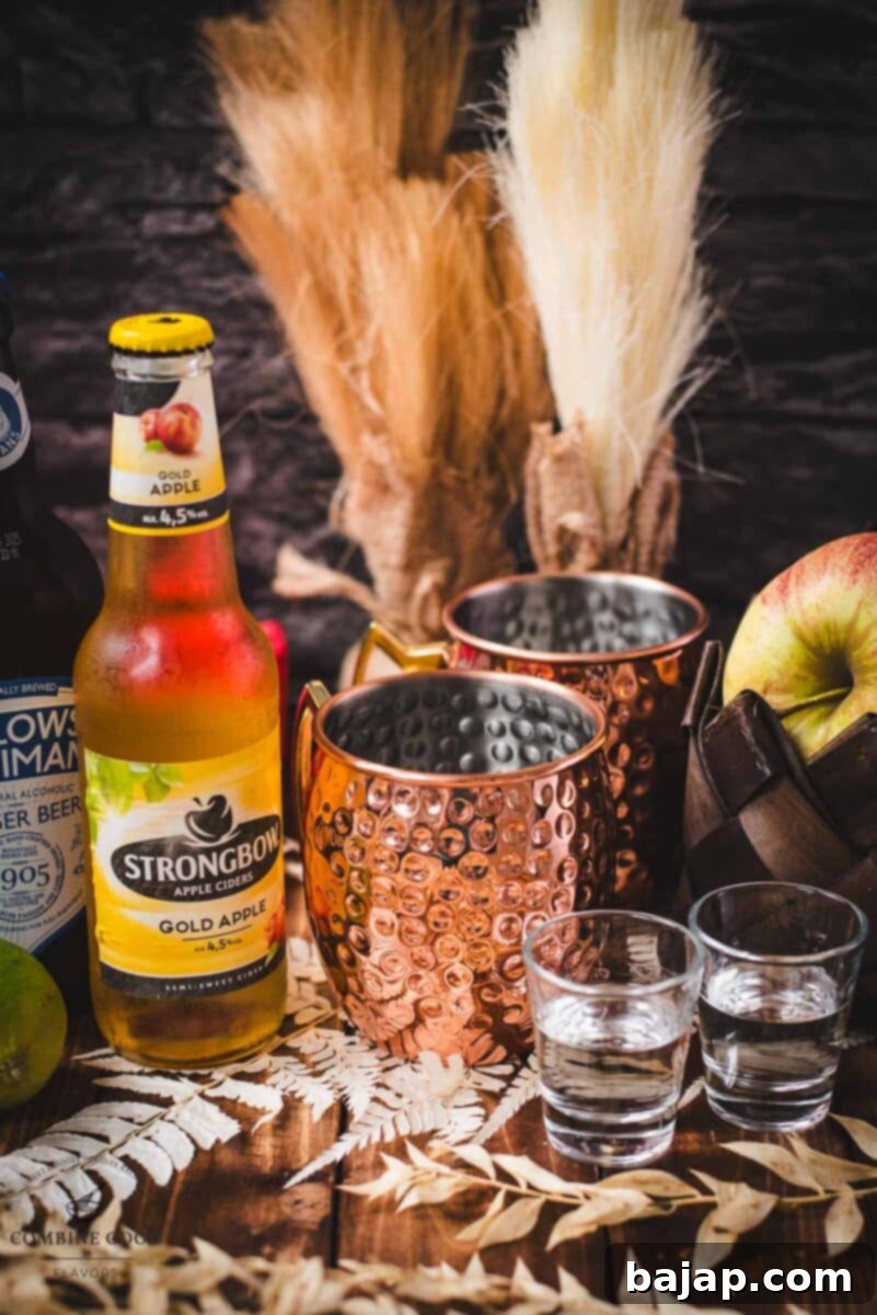 Autumn Apple Cider Moscow Mule 3 Ingredients for an apple cider Moscow mule - apple cider, lime juice, ginger beer, vodka.