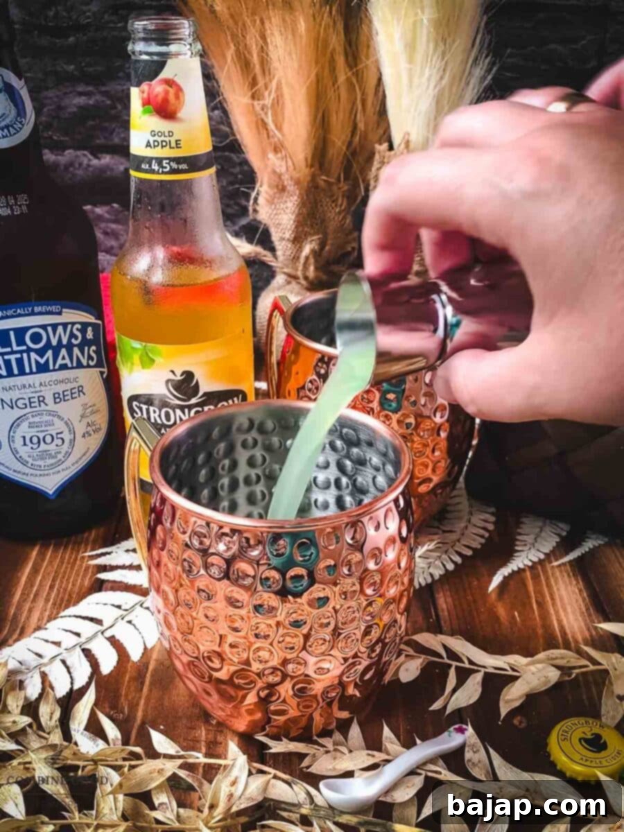 Crisp Apple Mule 6 Add freshly squeezed lime juice to your copper mugs.