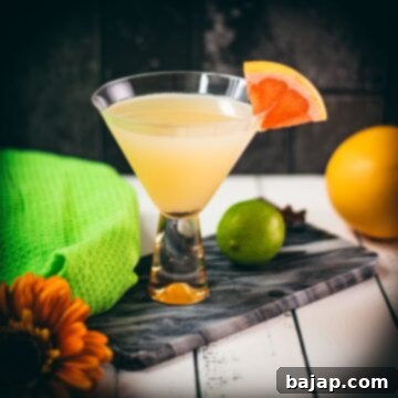 Vibrant Hemingway daiquiri, with a tart and slightly sweet flavor. Served in a gorgeous cocktail glass and placed on a marbled plate.