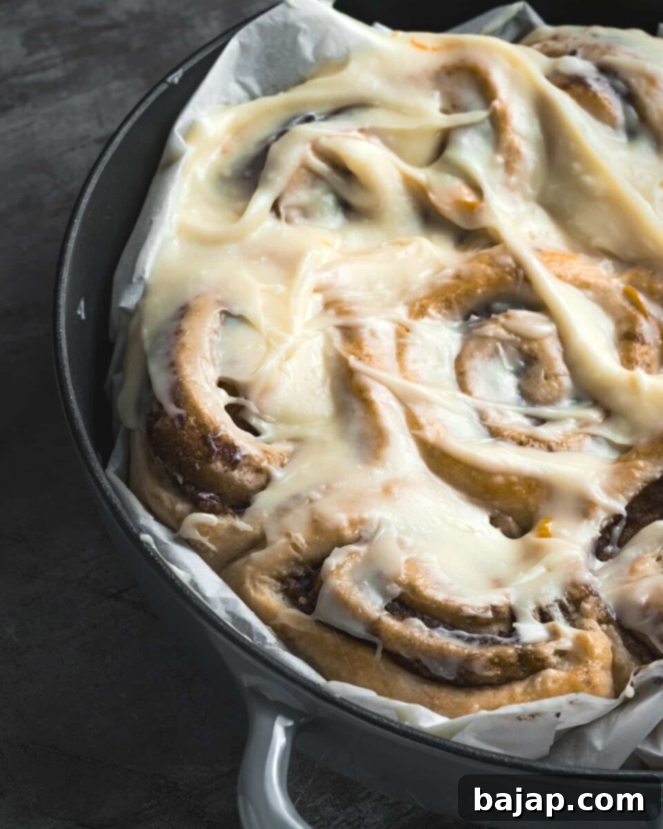 Unique Purple Potato Cinnamon Rolls with orange cream cheese frosting