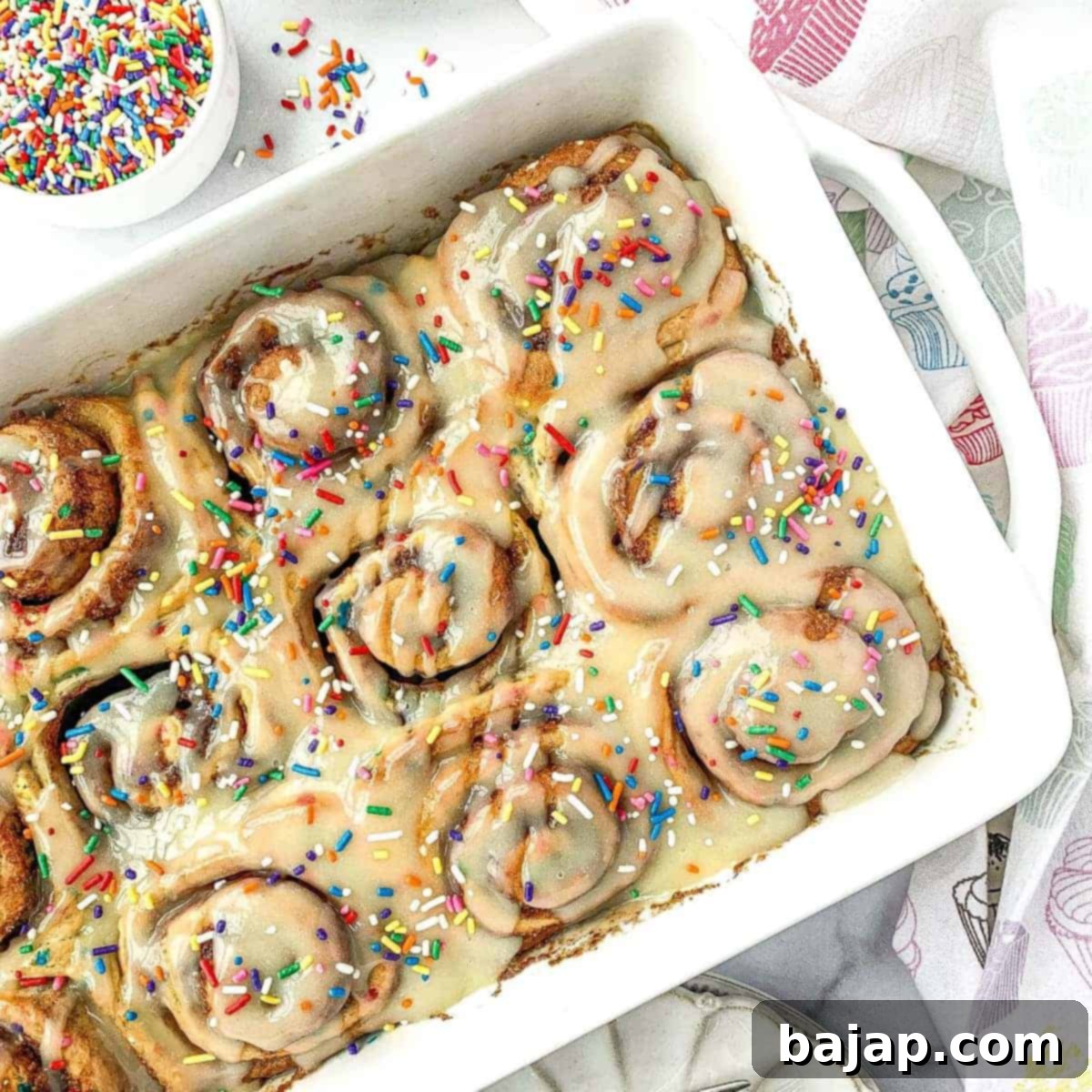 Bright and colorful Funfetti Cinnamon Rolls with rainbow sprinkles