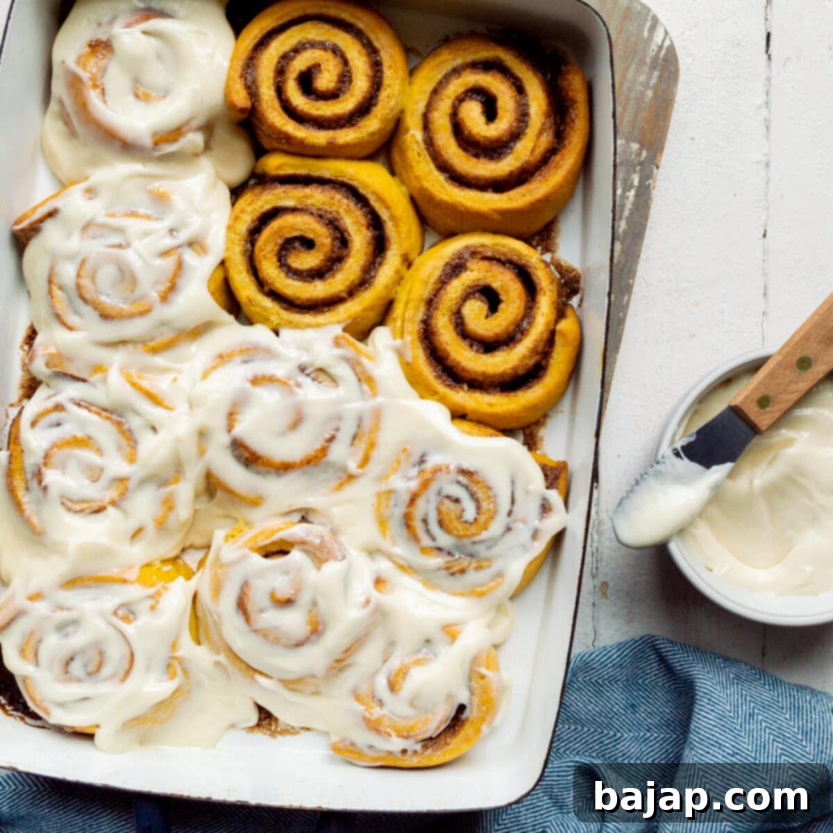 Pumpkin Cinnamon Rolls with Maple Cream Cheese Frosting