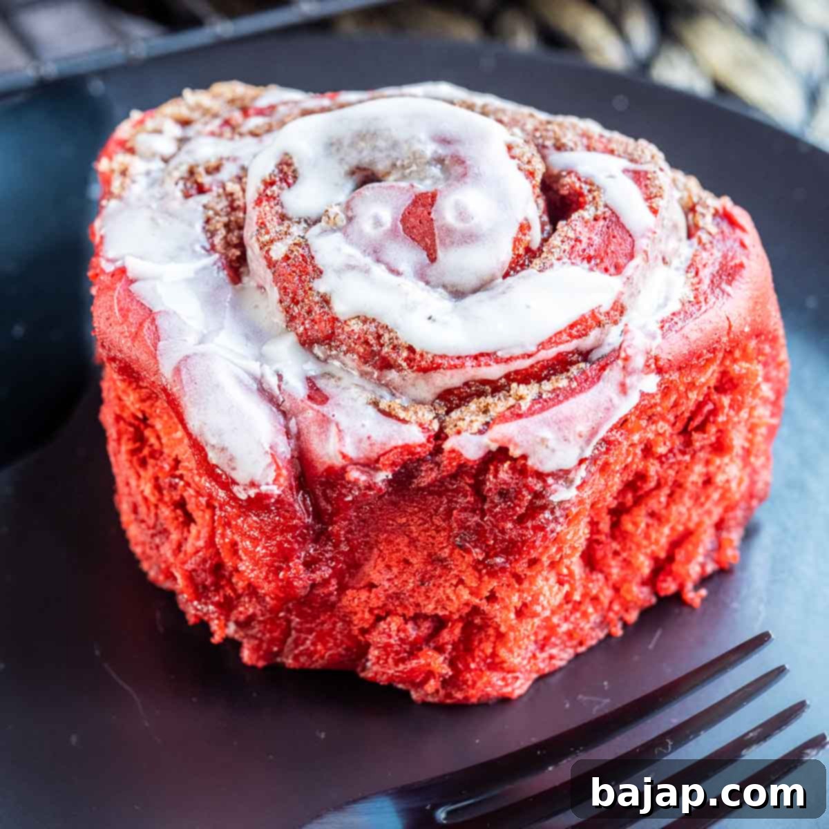 Red Velvet Cinnamon Rolls topped with cream cheese frosting