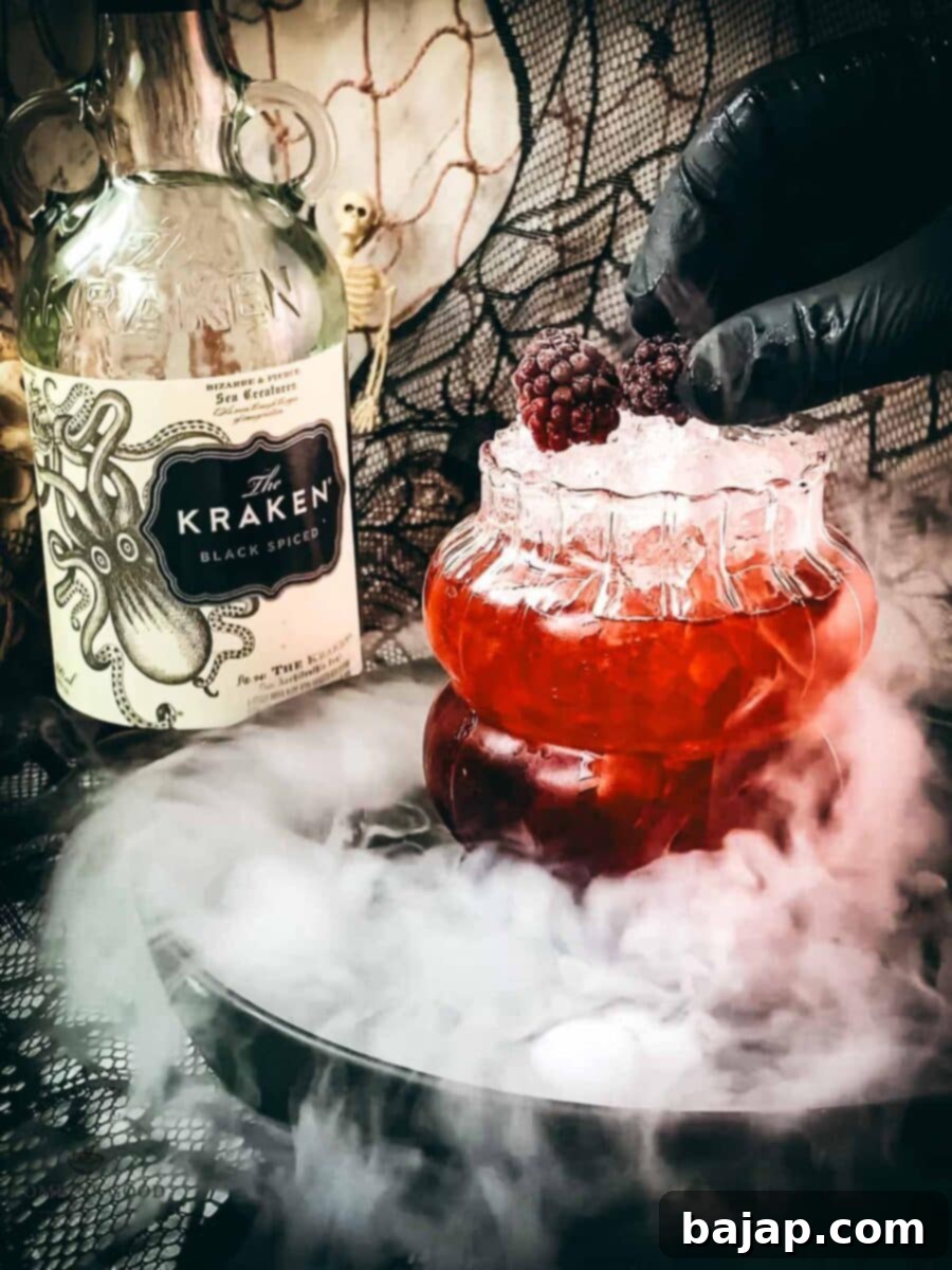 Garnish the cocktail with frozen blackberries.