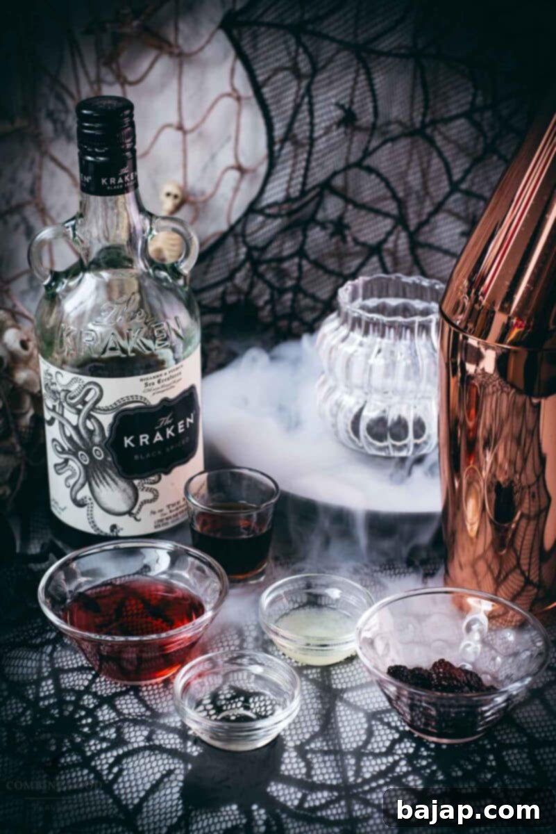 Ingredients for a Kramble Halloween cocktail - cranberry juice, lemon juice, sugar syrup, The Kraken black spiced rum, blackberries, and crushed ice.