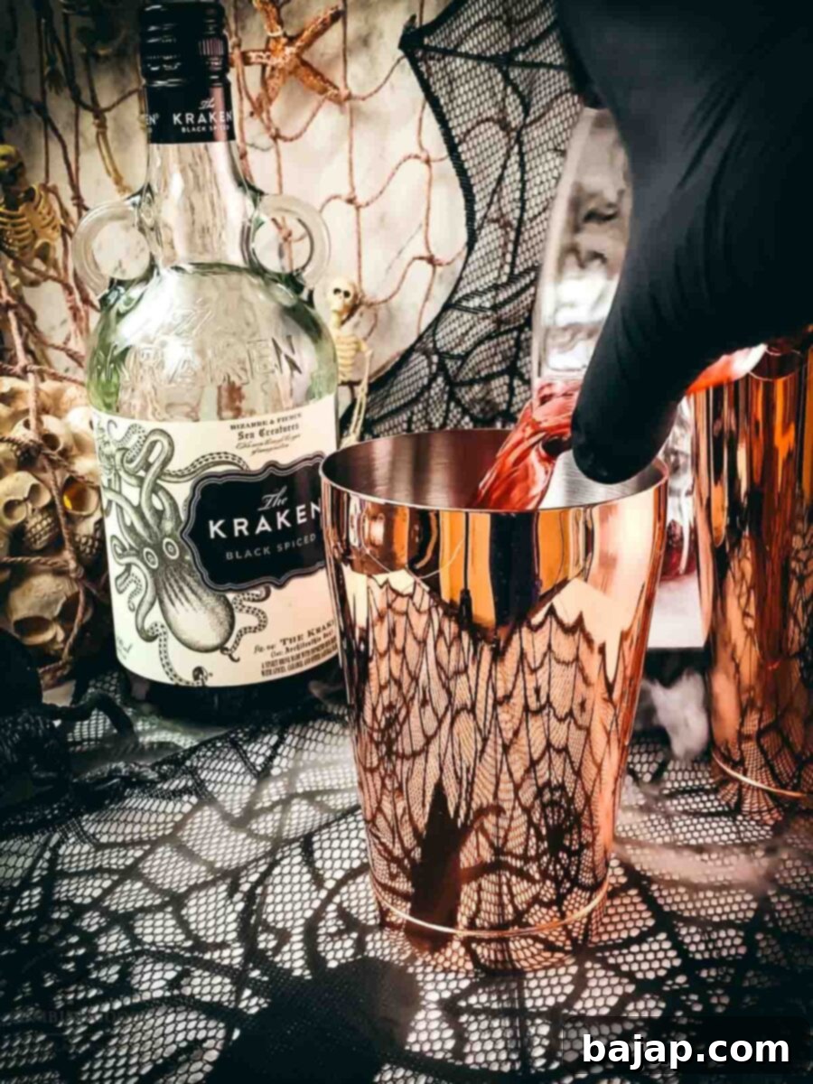 Add cranberry juice to the cocktail shaker tin.