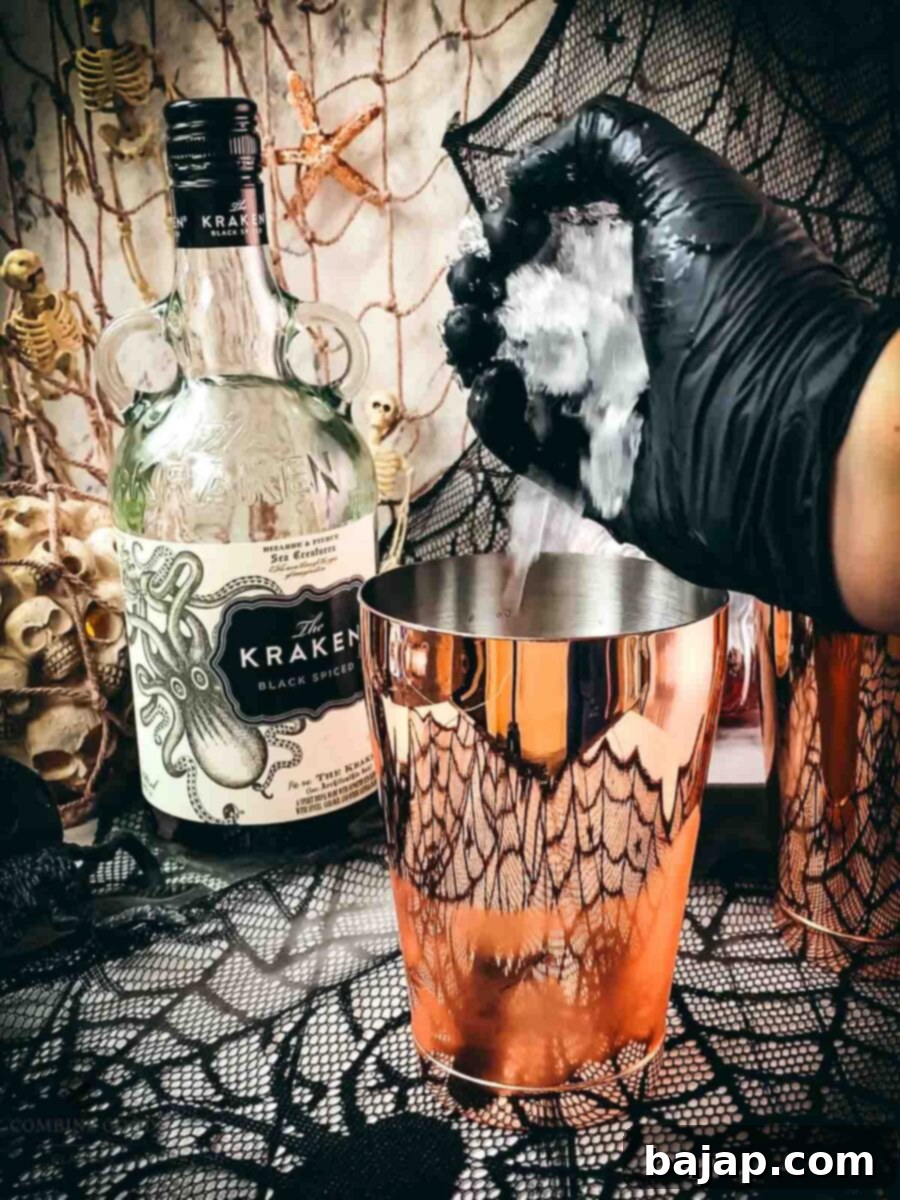 Add crushed ice to the cocktail shaker tin.