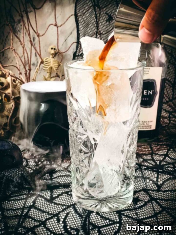 Step 2: Pour in The Kraken Black Spiced Rum.