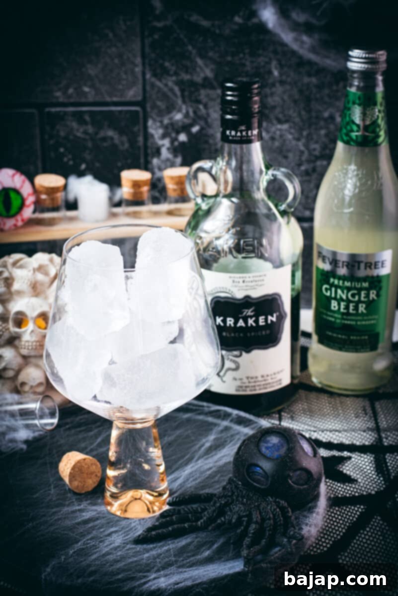 Ingredients ginger beer kraken - Cubed ice, The Kraken Black Spiced rum and Fever Tree Ginger beer.