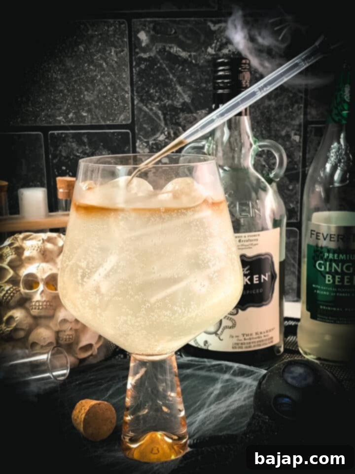 Gently dropping the rum on top of the ginger beer, using a pipette for the layered effect.