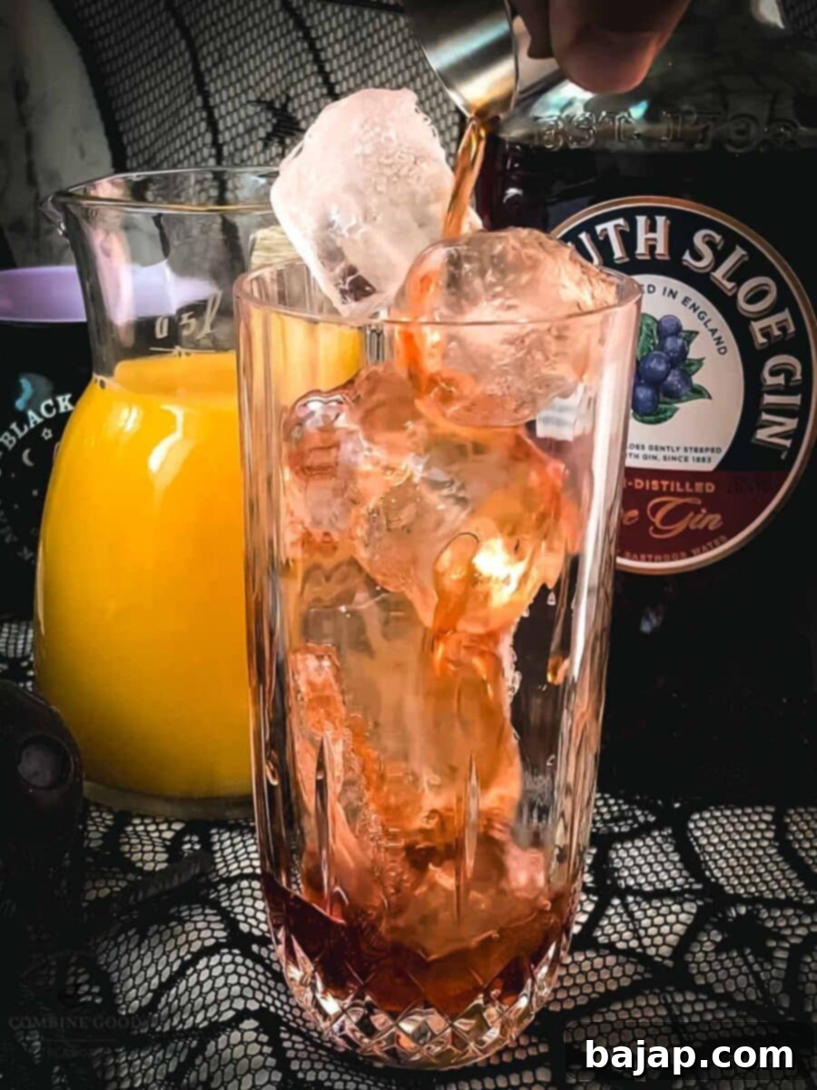 Spooky and delicious Sloe screw cocktail with Sloe gin and orange juice. Easy and delicious!