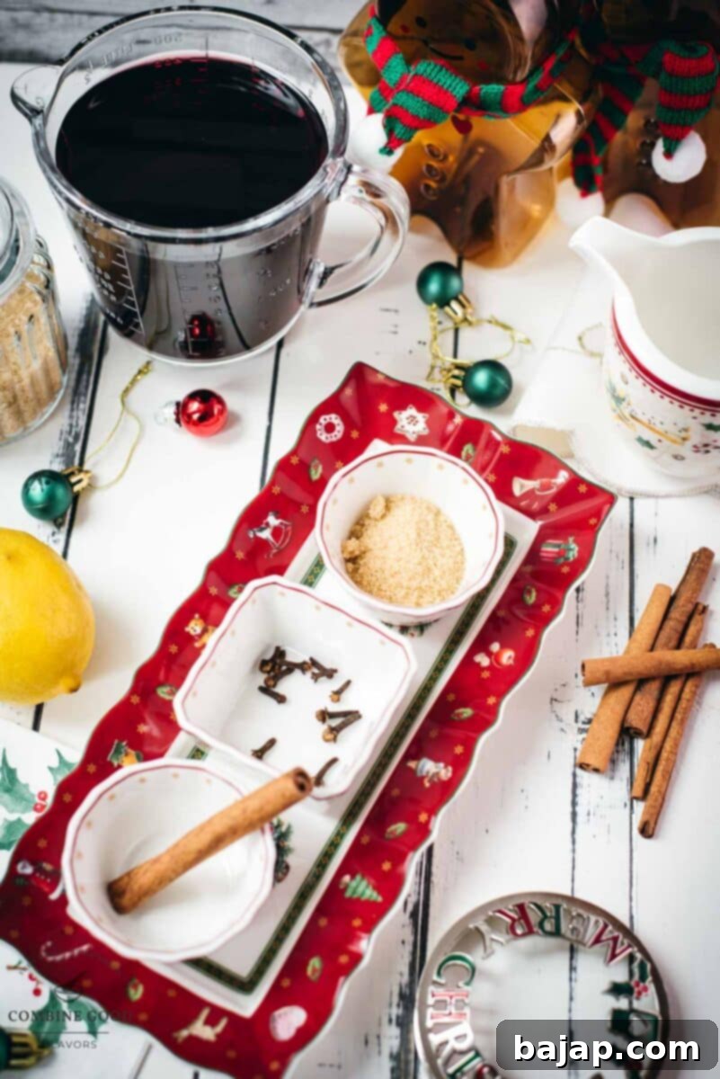 Austrian mulled wine ingredients - cinnamon stick, brown sugar, cloves, lemon, water, and red wine.