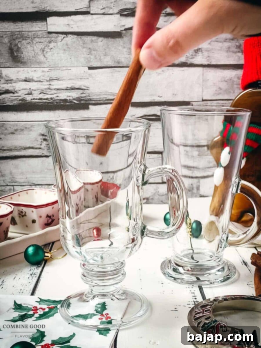 Warming Mulled Wine 4 Add one cinnamon stick to the serving glass.