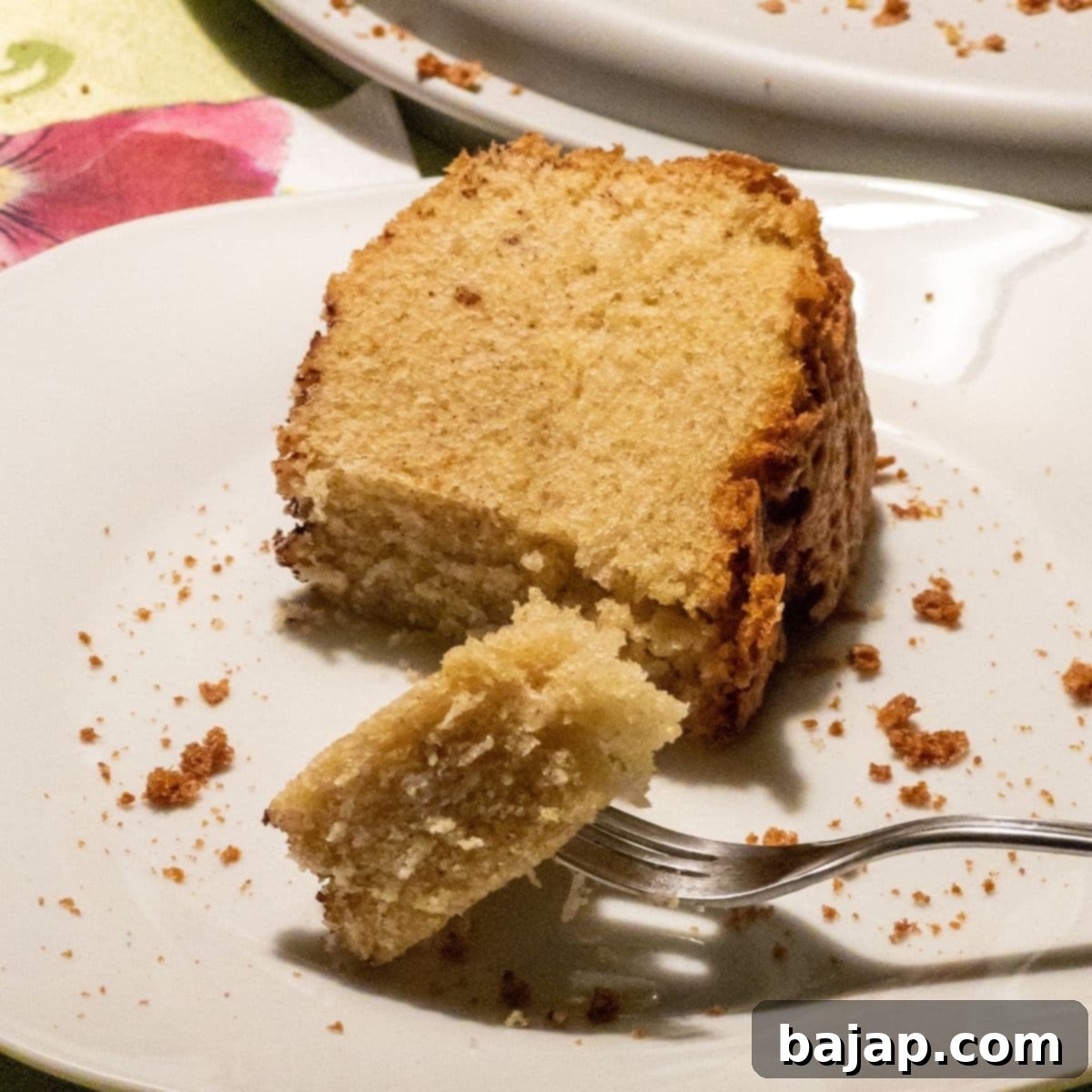 A scrumptious fluffy slice of the best potato flour eggnog cake!