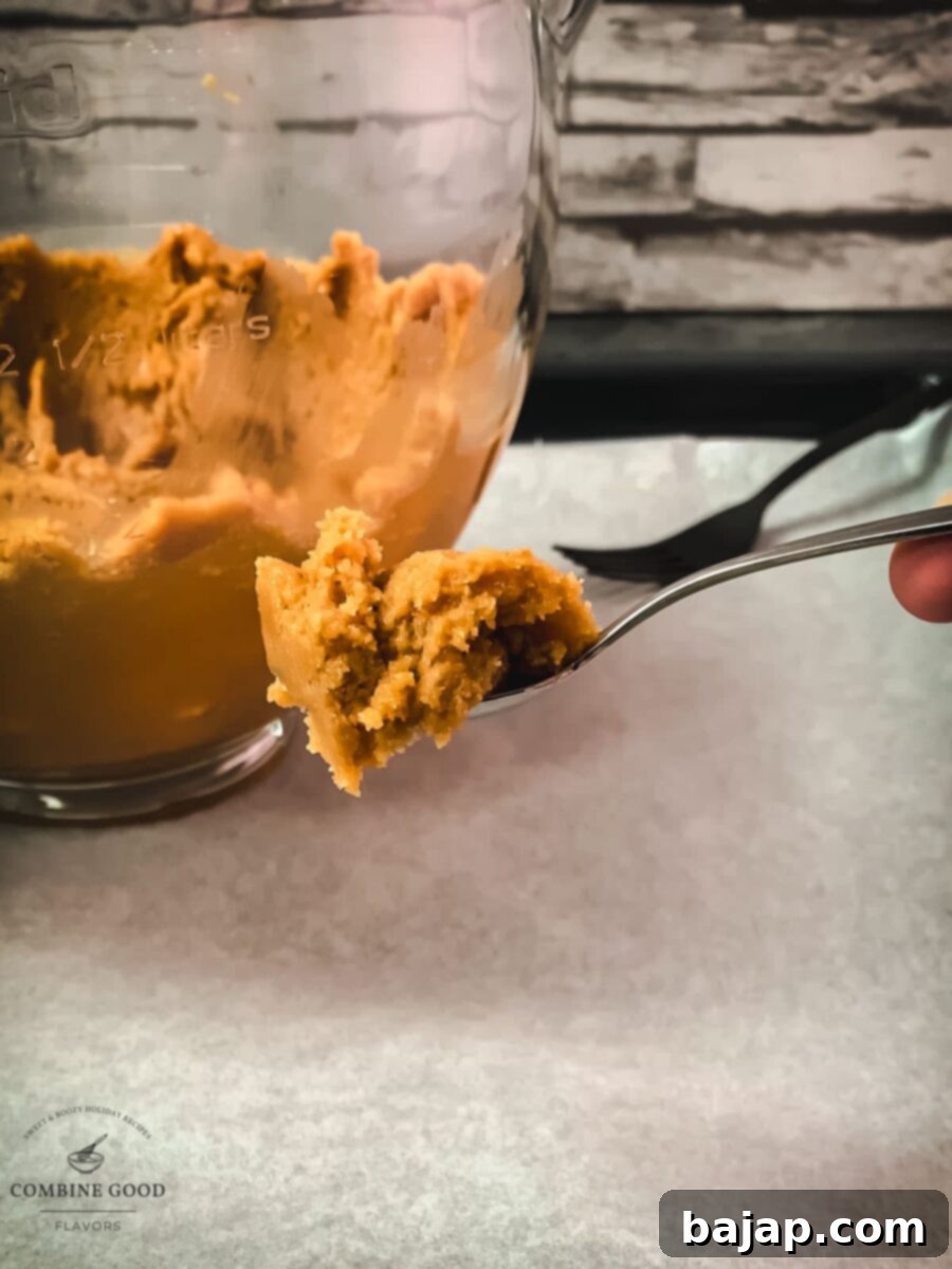 Small teaspoon-sized portion of Betty Crocker peanut butter cookie dough ready for rolling.