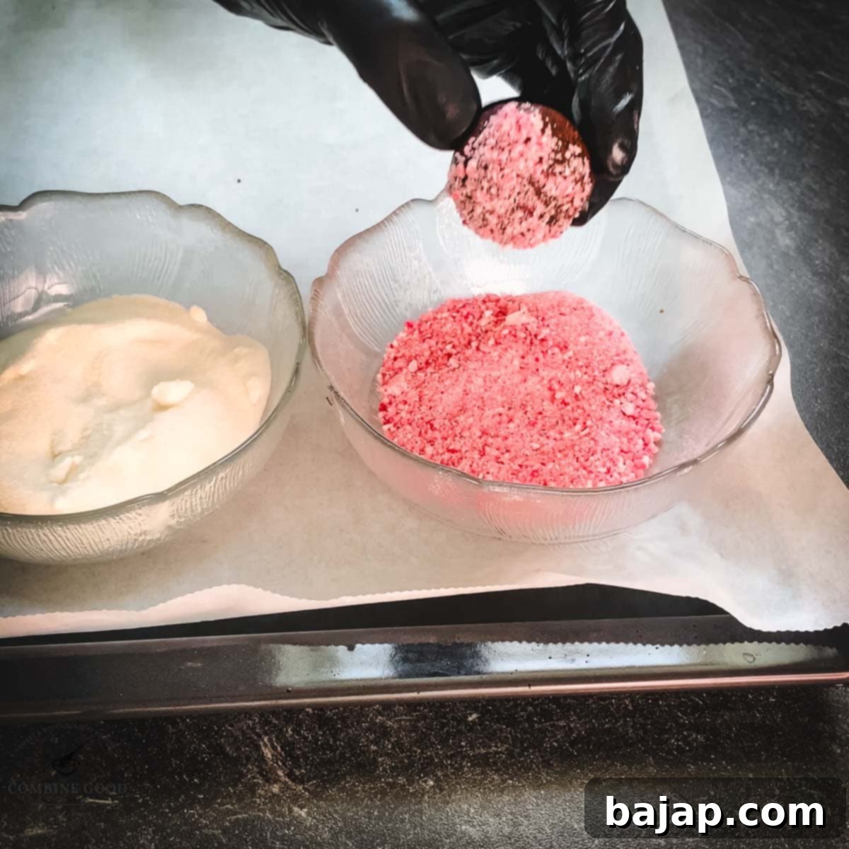 Minty Chocolate Crinkle Delights 12 A gloved hand expertly coating a chocolate peppermint dough ball with crushed candy canes.