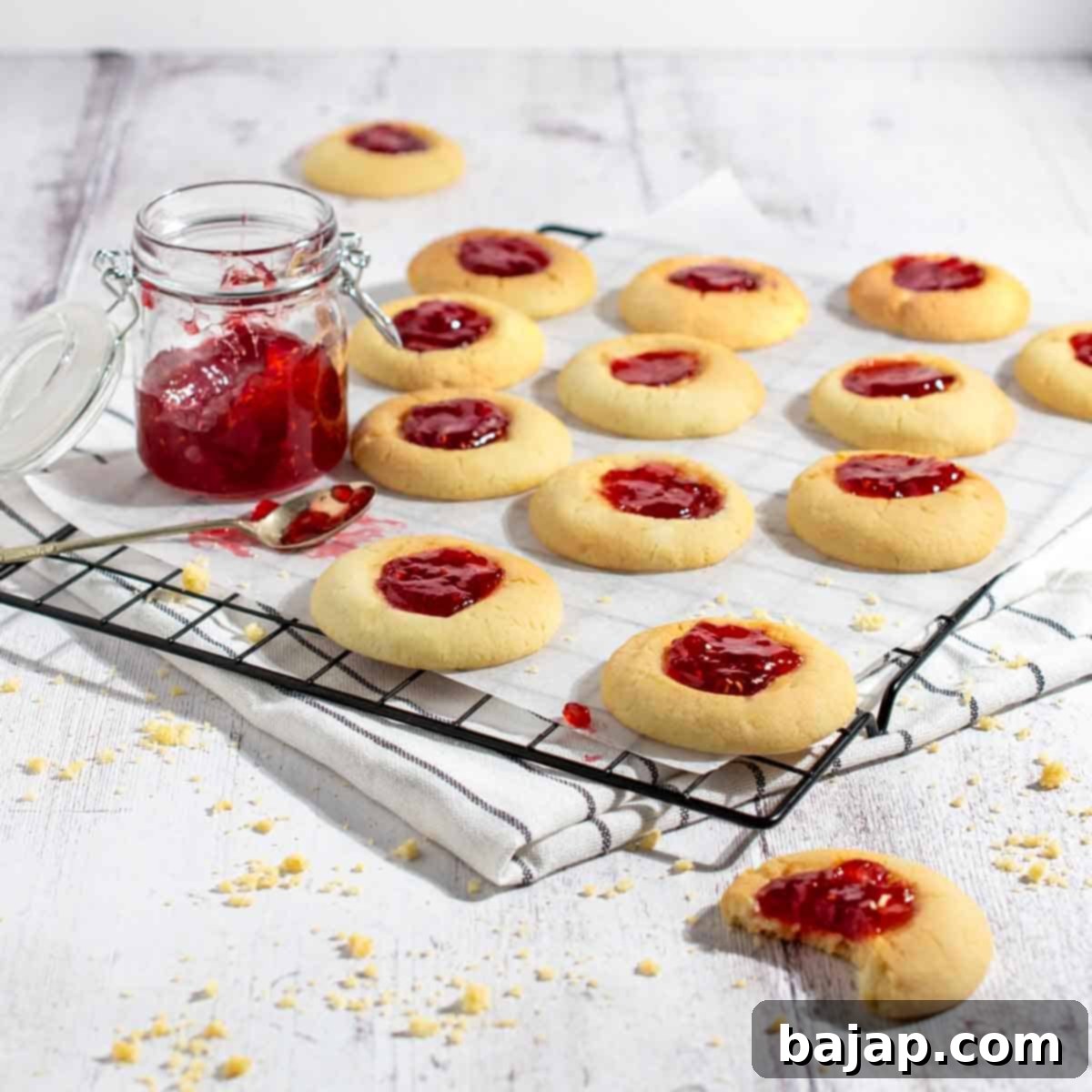 Global Holiday Cookie Tour 3 Swedish Hallongrottor thumbprint cookies with raspberry jam.