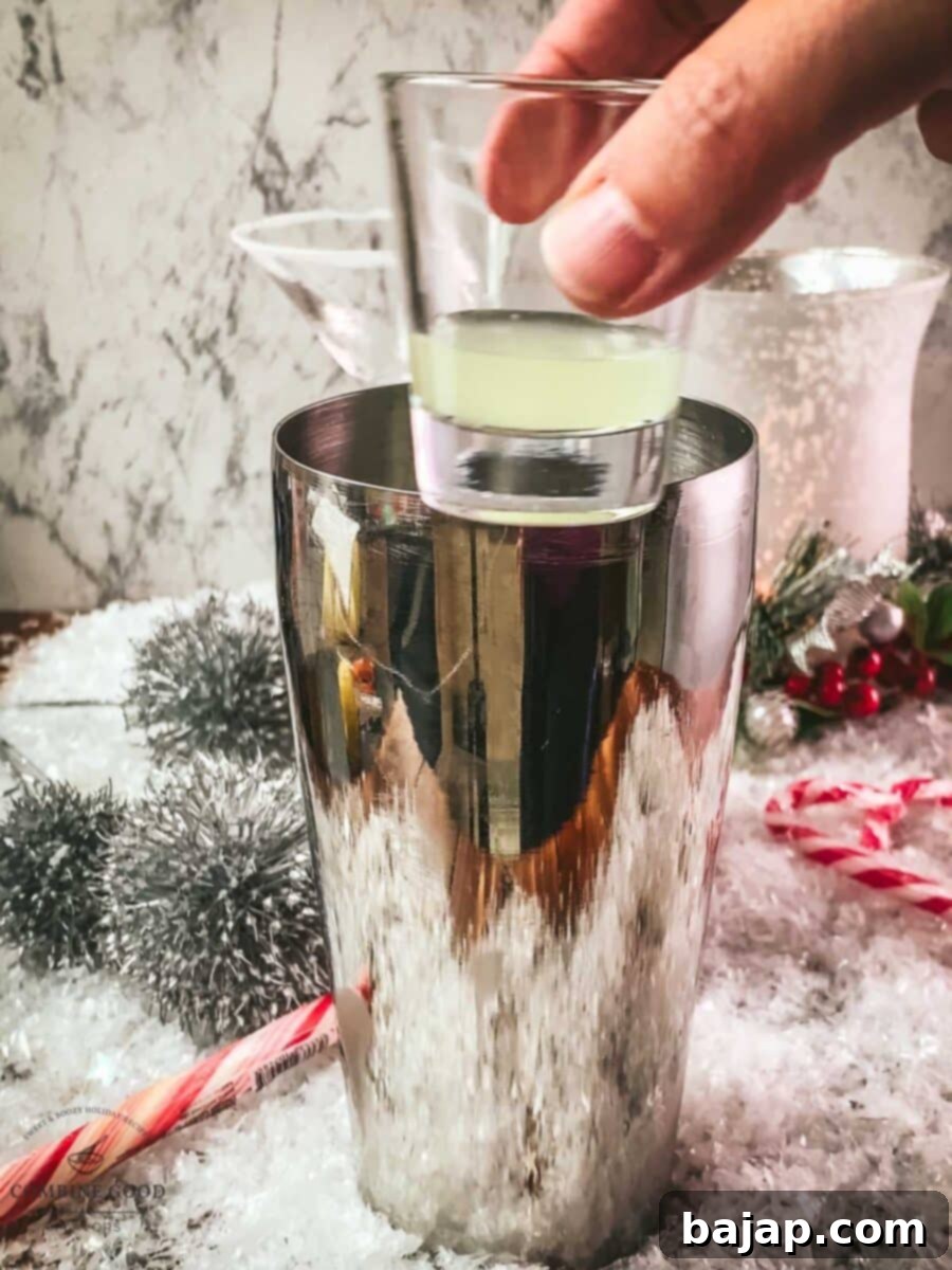 Add lime juice to the cocktail shaker.