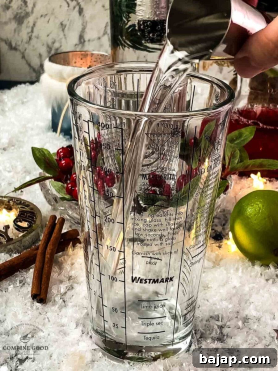 Add gin to the cocktail shaker.