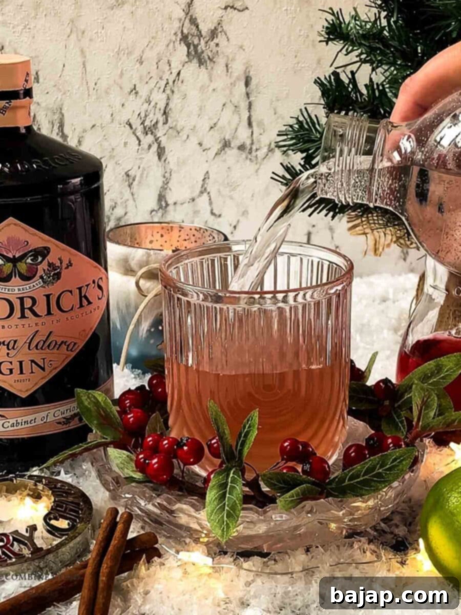 Crimson Gin Fizz 10 Top with sparkling water.