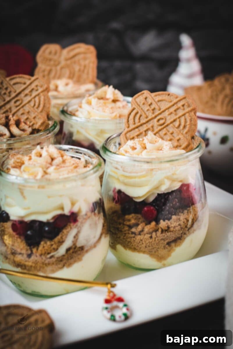 Holiday Trifle Shots 2 Gorgeous mini Christmas trifles with delicious speculoos cookies, a mascarpone cream mix, and frozen berries. Perfect individual holiday desserts.