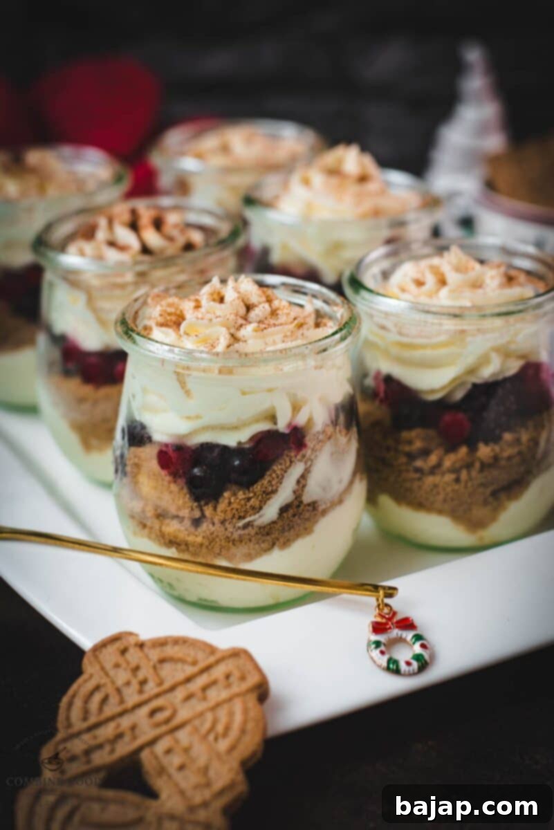 Holiday Trifle Shots 13 Gorgeous mini Christmas trifles with delicious speculoos cookies, a mascarpone cream mix, and frozen berries, ready to be served.