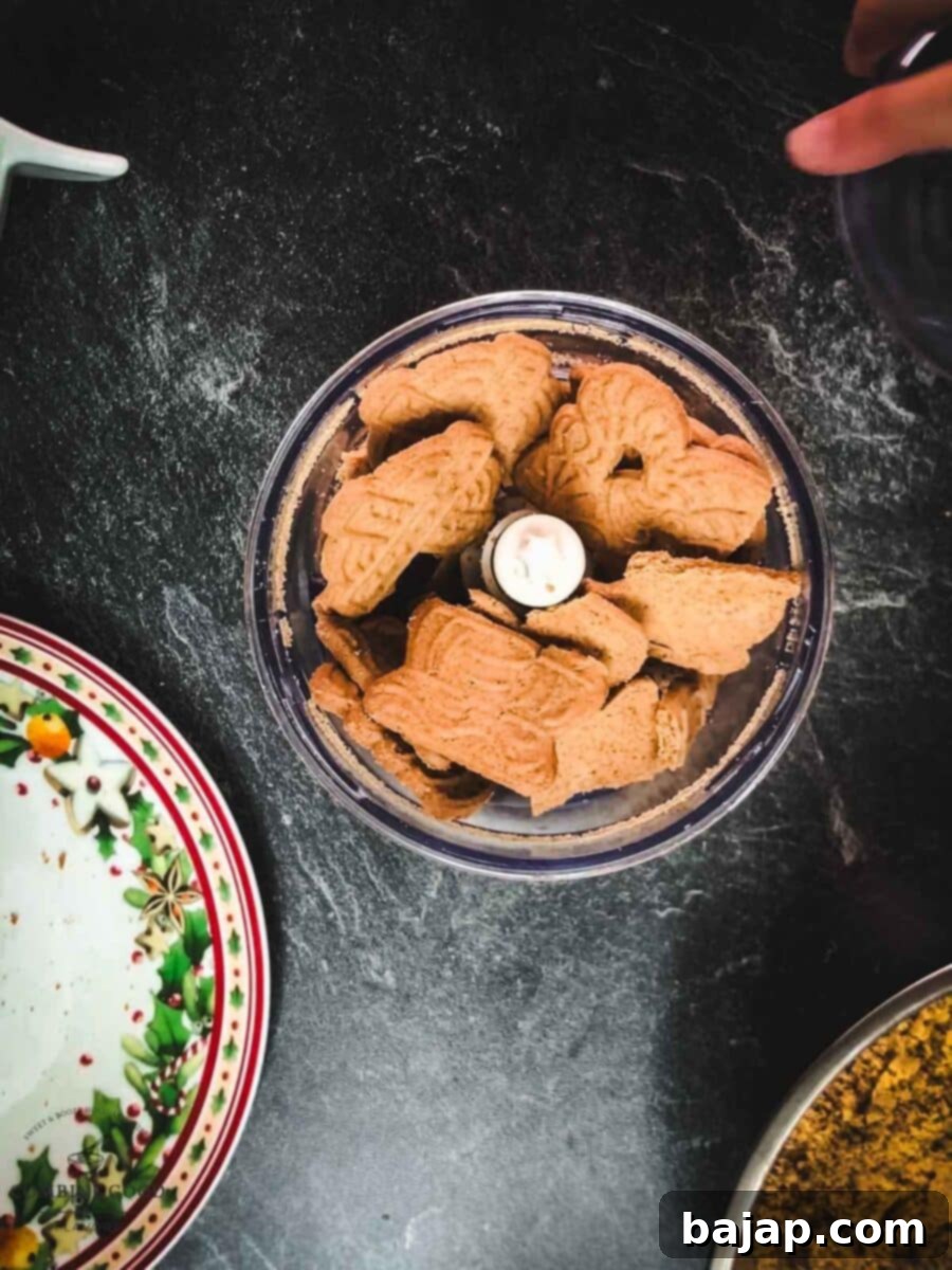 Crush the speculoos cookies using an electric chopper or a rolling pin and a ziplock bag.