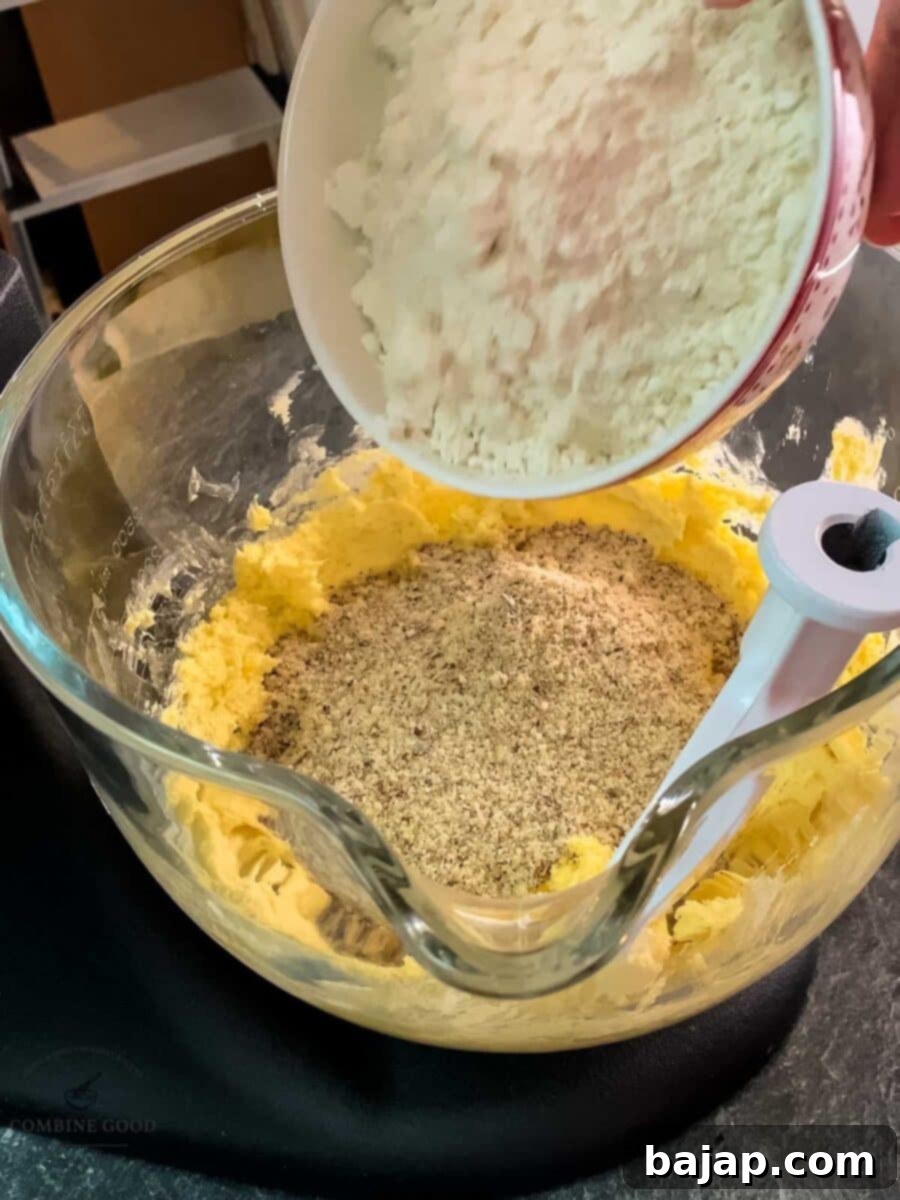 Viennese Vanilla Crescents 7 Add the flour to the mix.