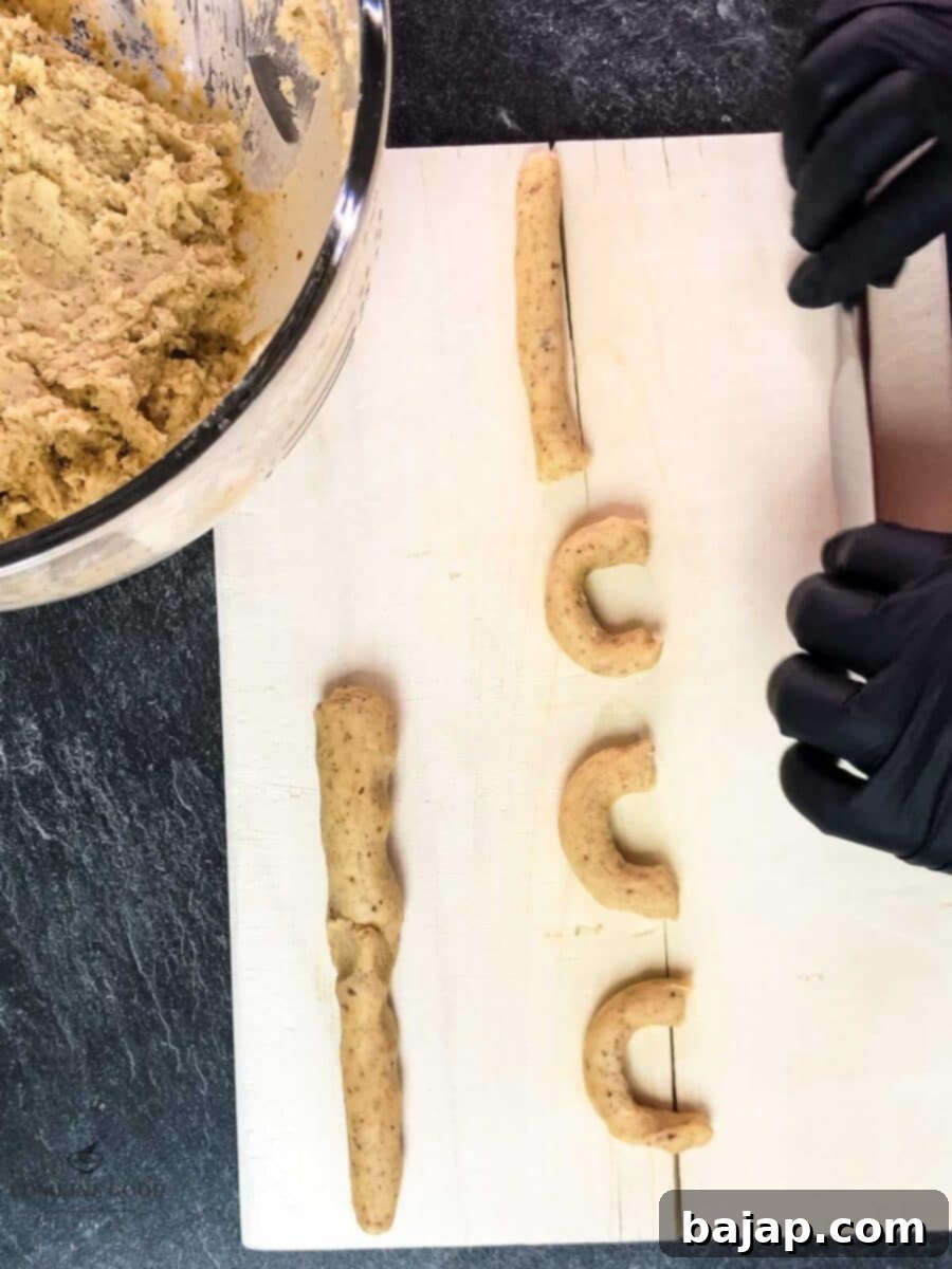 Viennese Vanilla Crescents 9 Roll the dough into sticks and cut it into small pieces before shaping them into crescents.