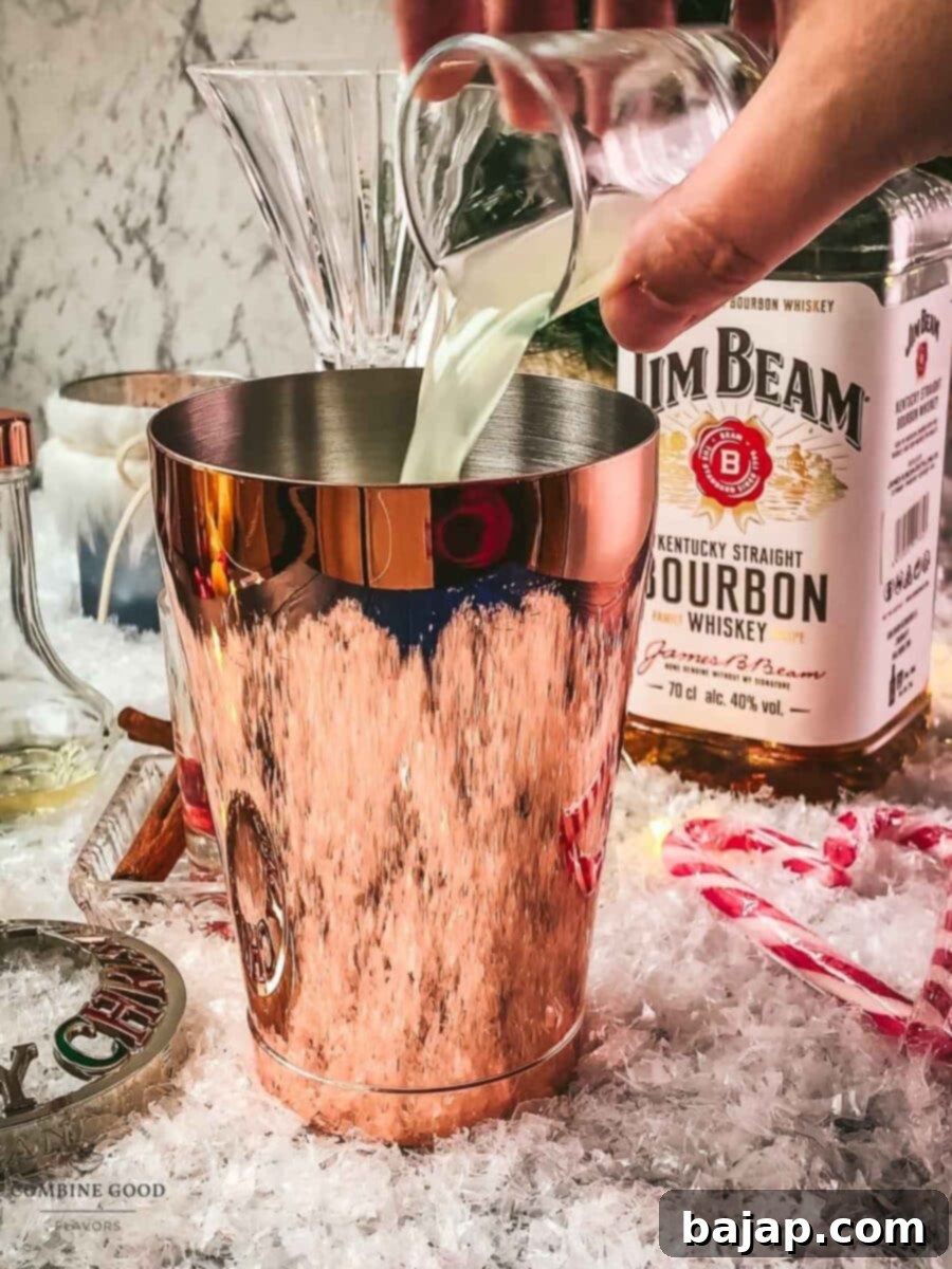 Add fresh lemon juice to the cocktail shaker.