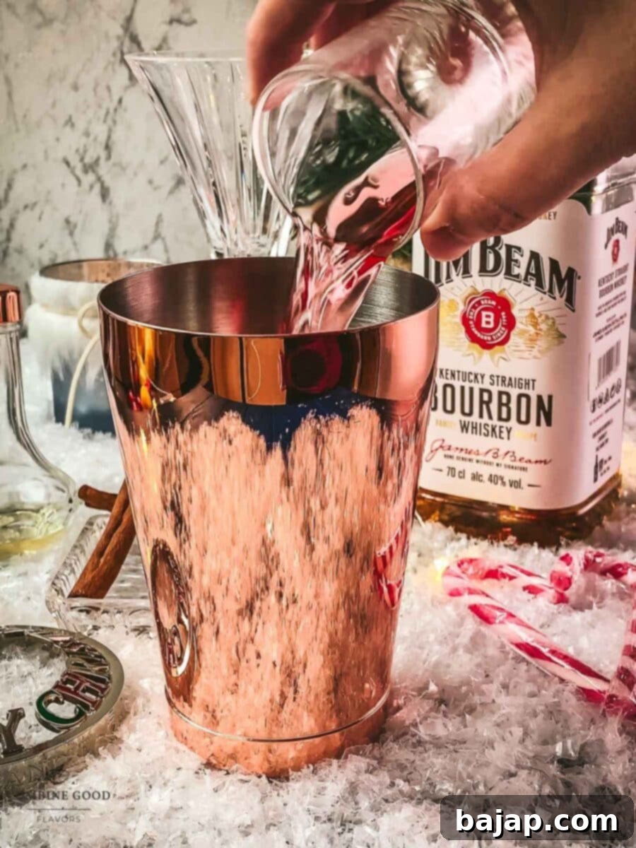 Add tart cranberry juice to the cocktail shaker.