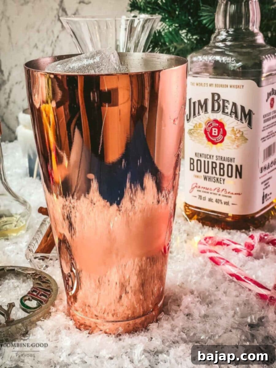 Add cubed ice to the cocktail shaker for chilling.