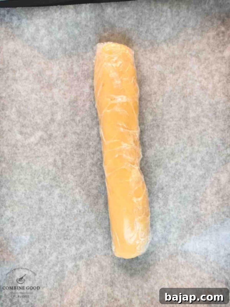 Cling film wrapped cookie dough after chilling.