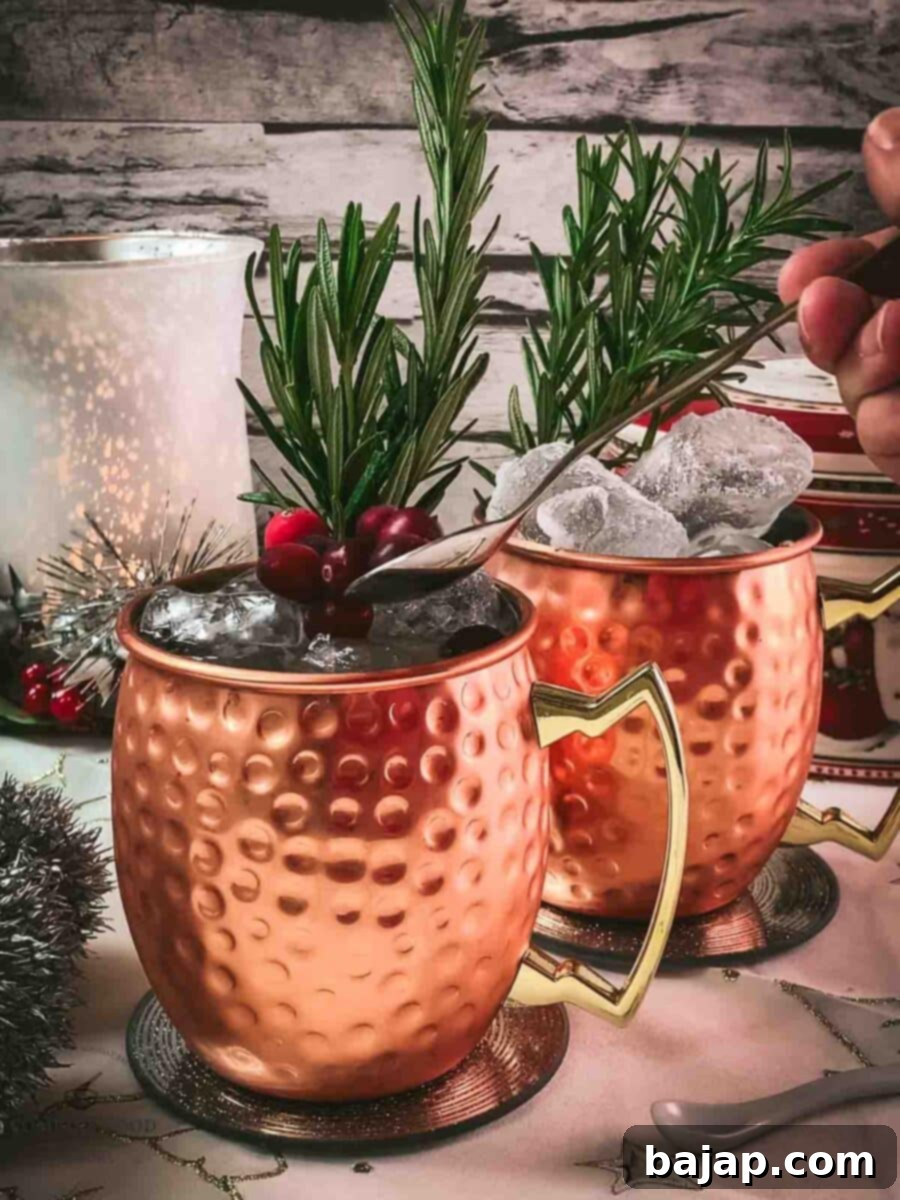Place frozen cranberries and rosemary twigs as a garnish.