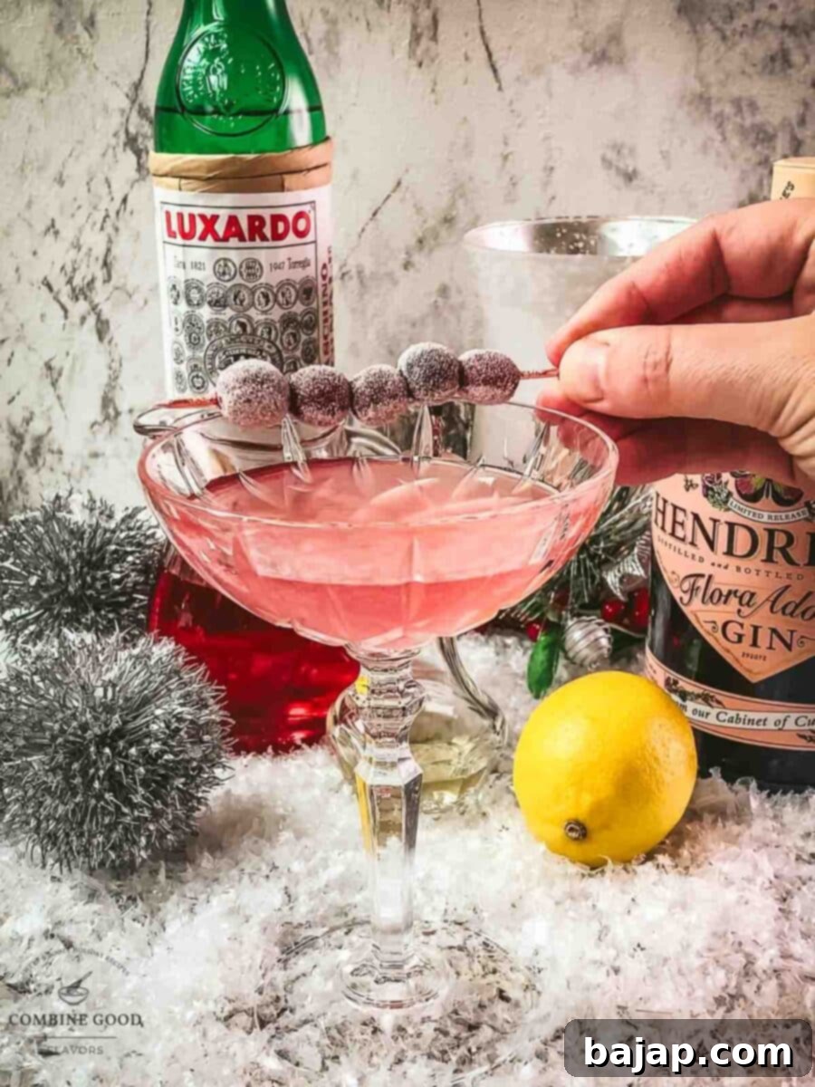 Place the frosted cranberries with the cocktail skewer on top of the glass.