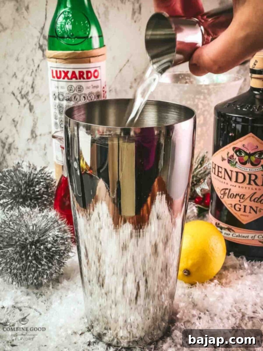 Add gin to the shaker tin.