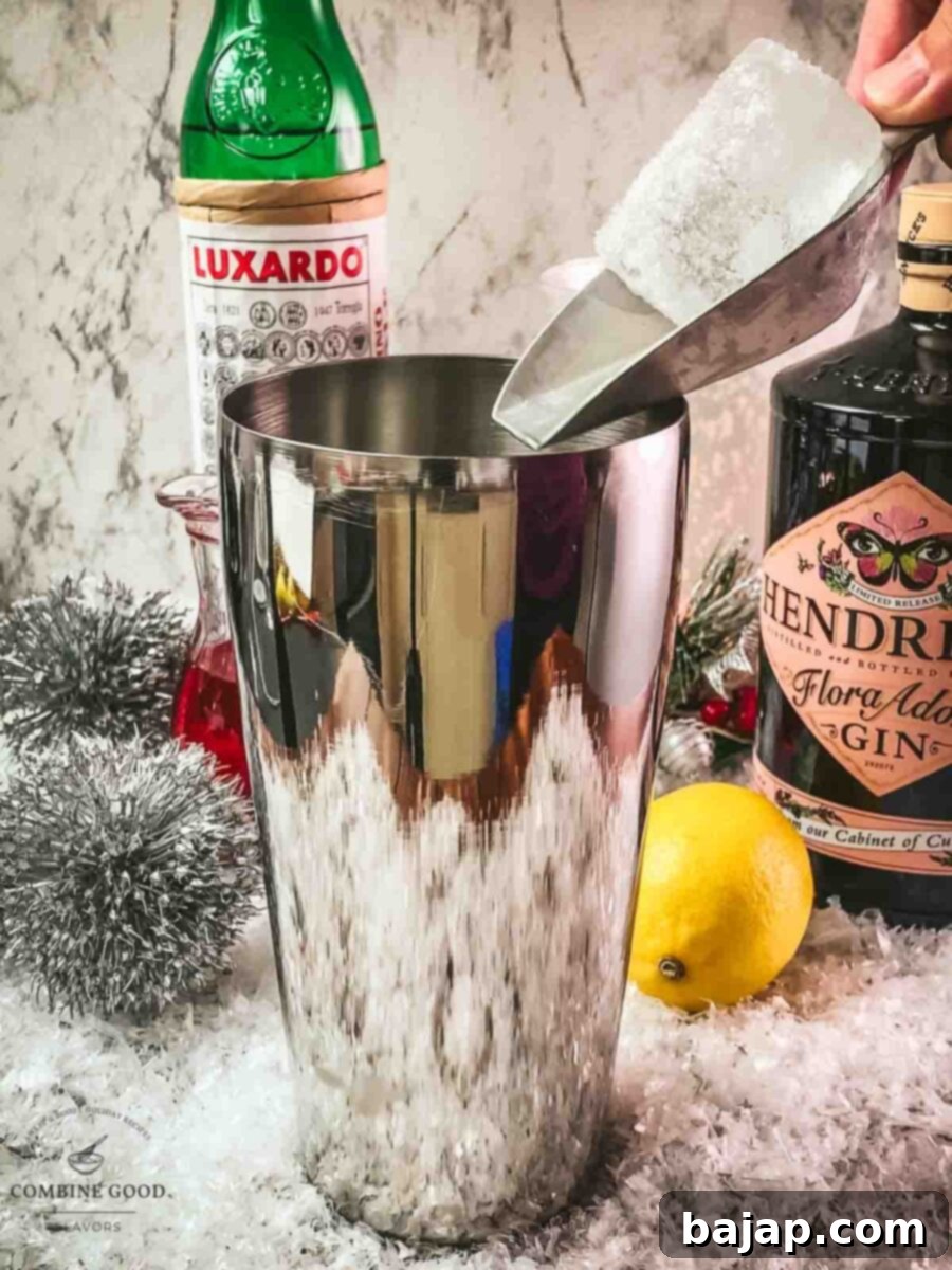 Add cubed ice to the shaker tin.