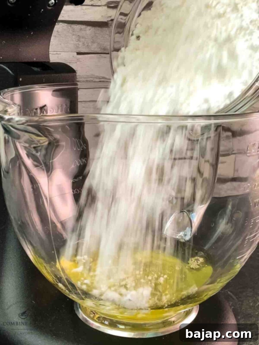 Add powdered sugar to the egg whites.