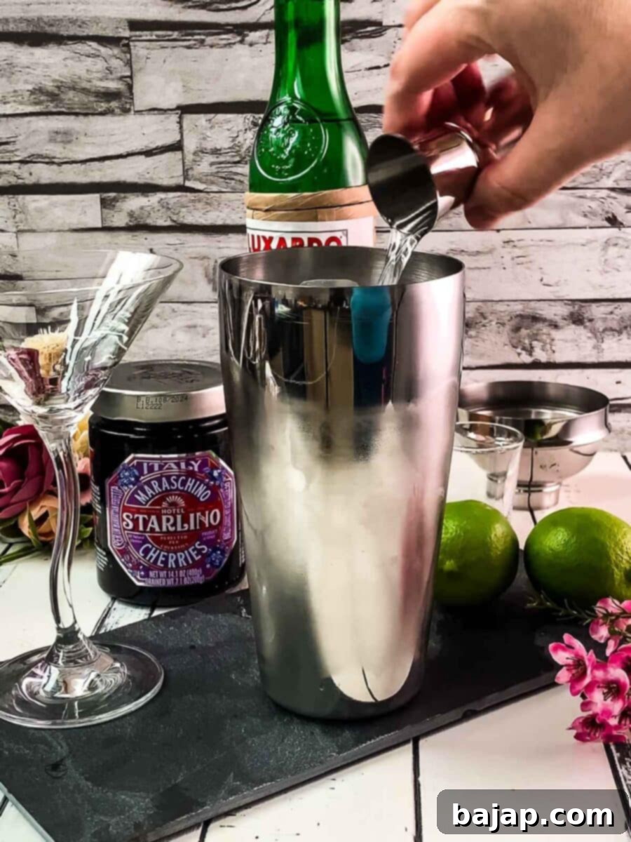 Add Maraschino liqueur to the shaker.