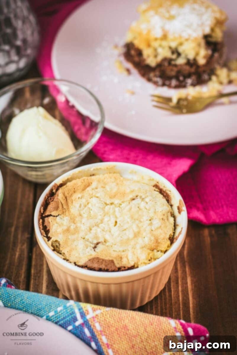 Creamy Baked Rice Pudding 2 Delicious marbled rice pudding mini casserole placed on wooden board next to a scoop of vanilla ice cream.