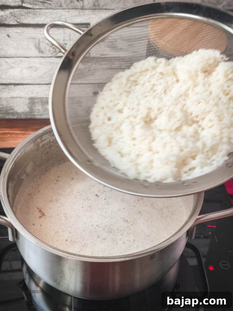 Add the cooked rice to the vanilla milk mixture.