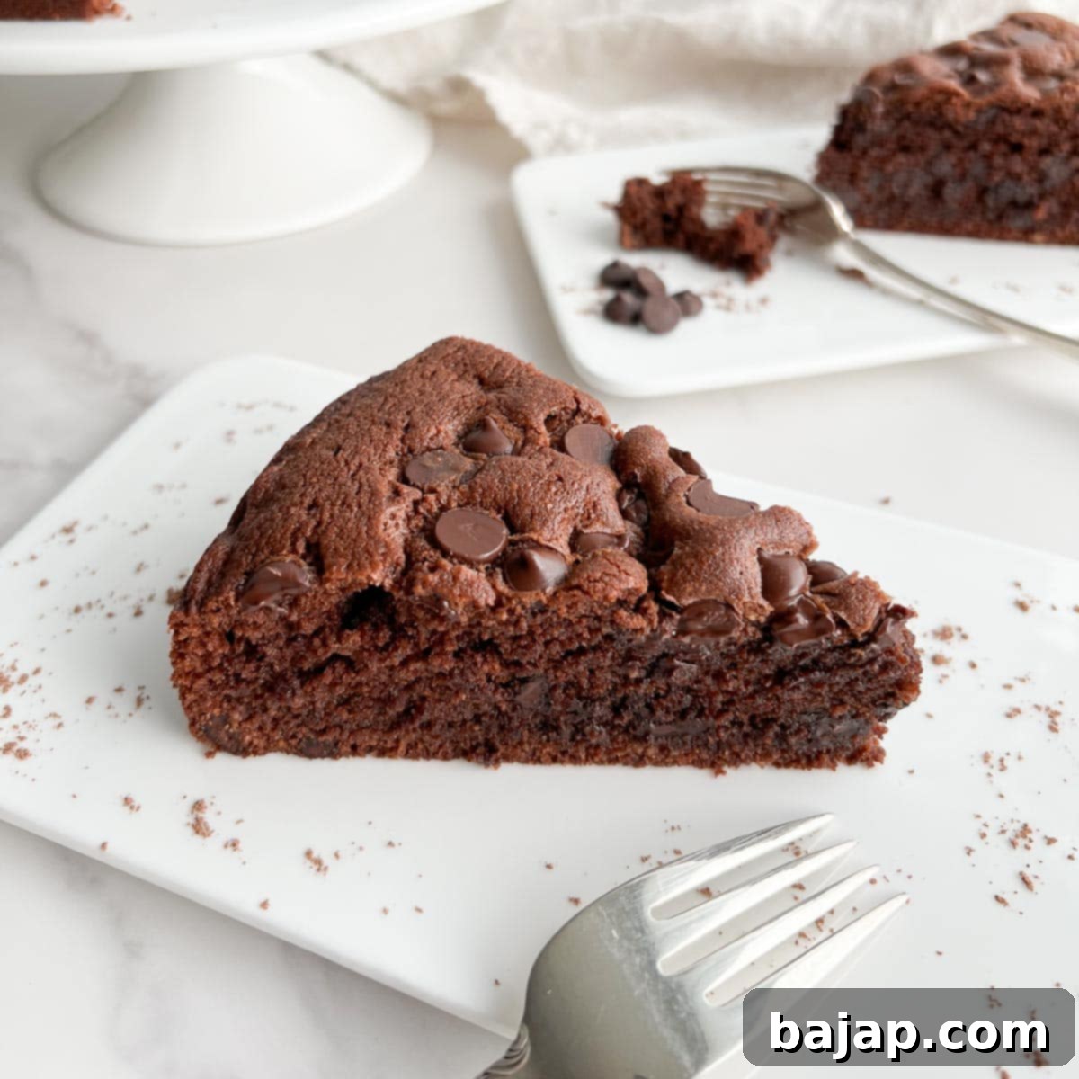 A slice of rich Chocolate Ricotta Cake with a creamy texture.