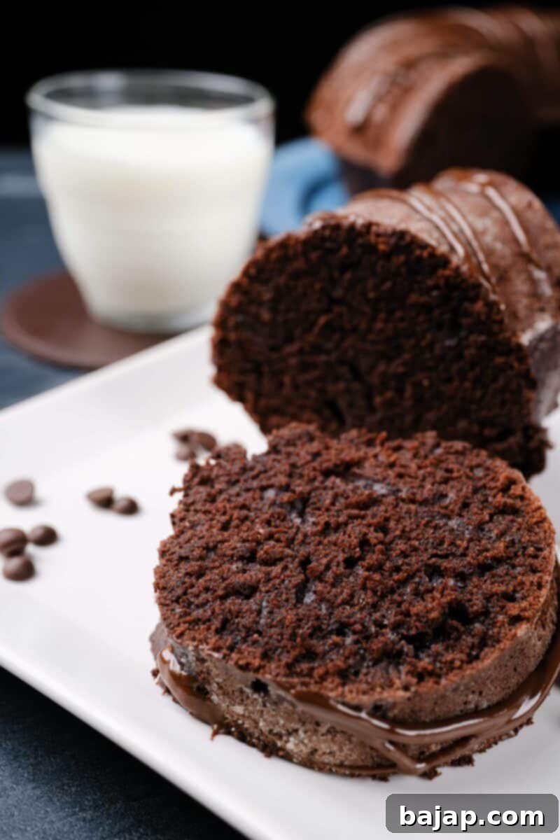 A close-up of a slice of Healthy Chocolate Cake, showing its moist and dense texture.