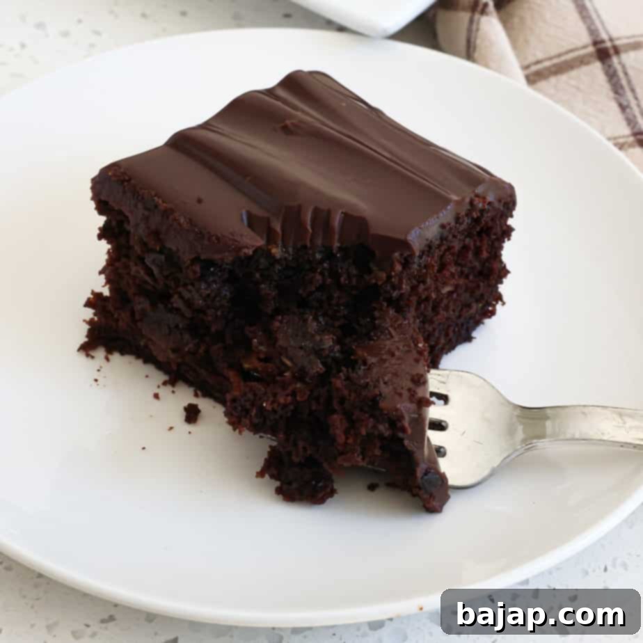 A delectable Chocolate Zucchini Cake with a rich chocolate ganache glaze.