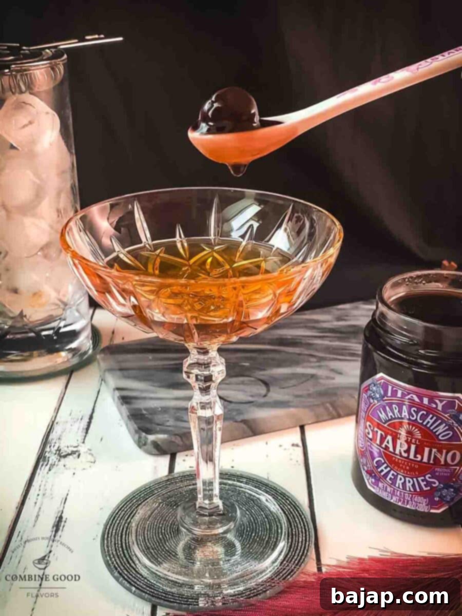 Garnish the Manhattan with a Maraschino cherry.