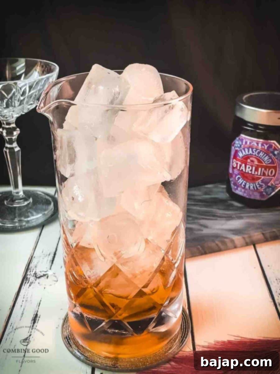 Add cubed ice to the stirring glass.