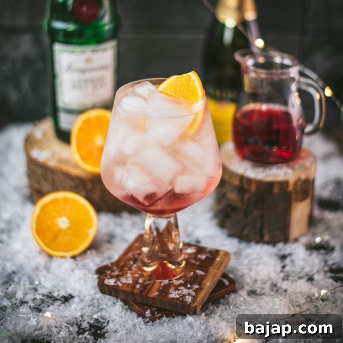 Stunning cranberry gin spritz, garnished with a slice of orange. Refreshing and festive!