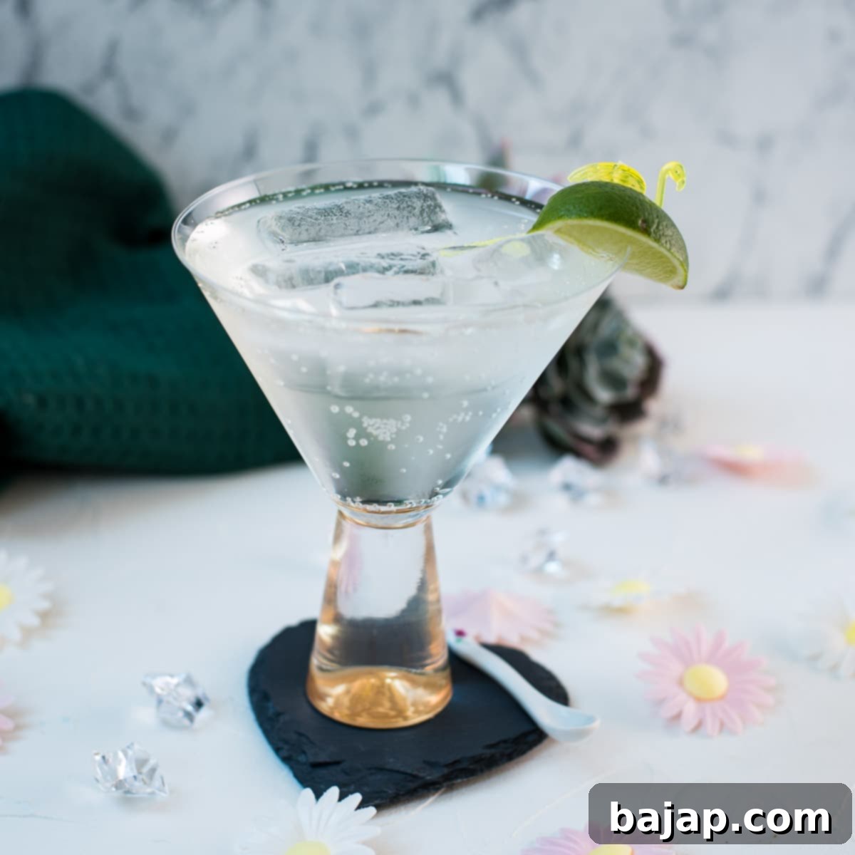 Easy and delicious! Vermouth tonic, in a gorgeous cocktail glass, placed on a black heartshaped slate coaster.